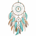 Attrape-rêves avec plumes turquoise et perles décoratives